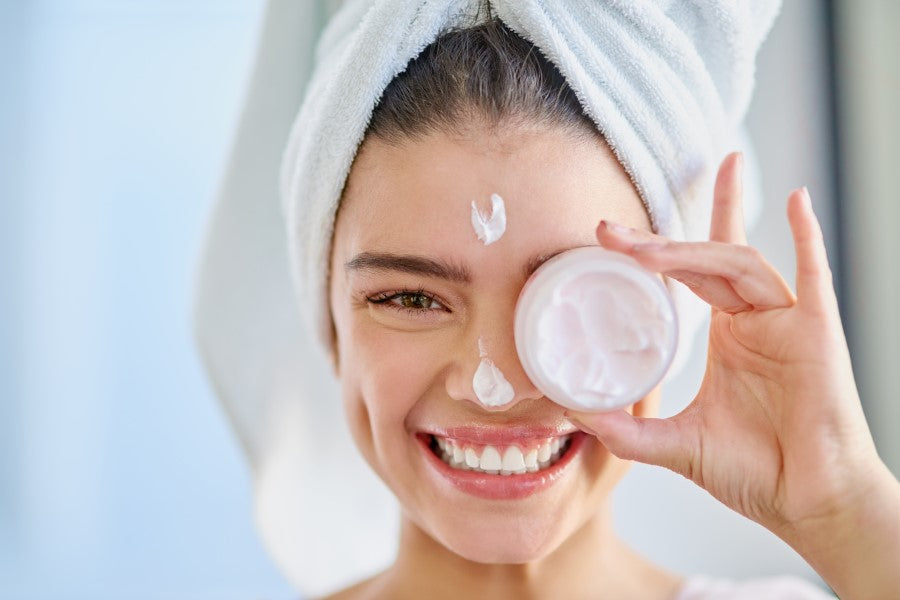 woman holding a moisturizer